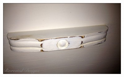 wood handle painted with white paint and distressed