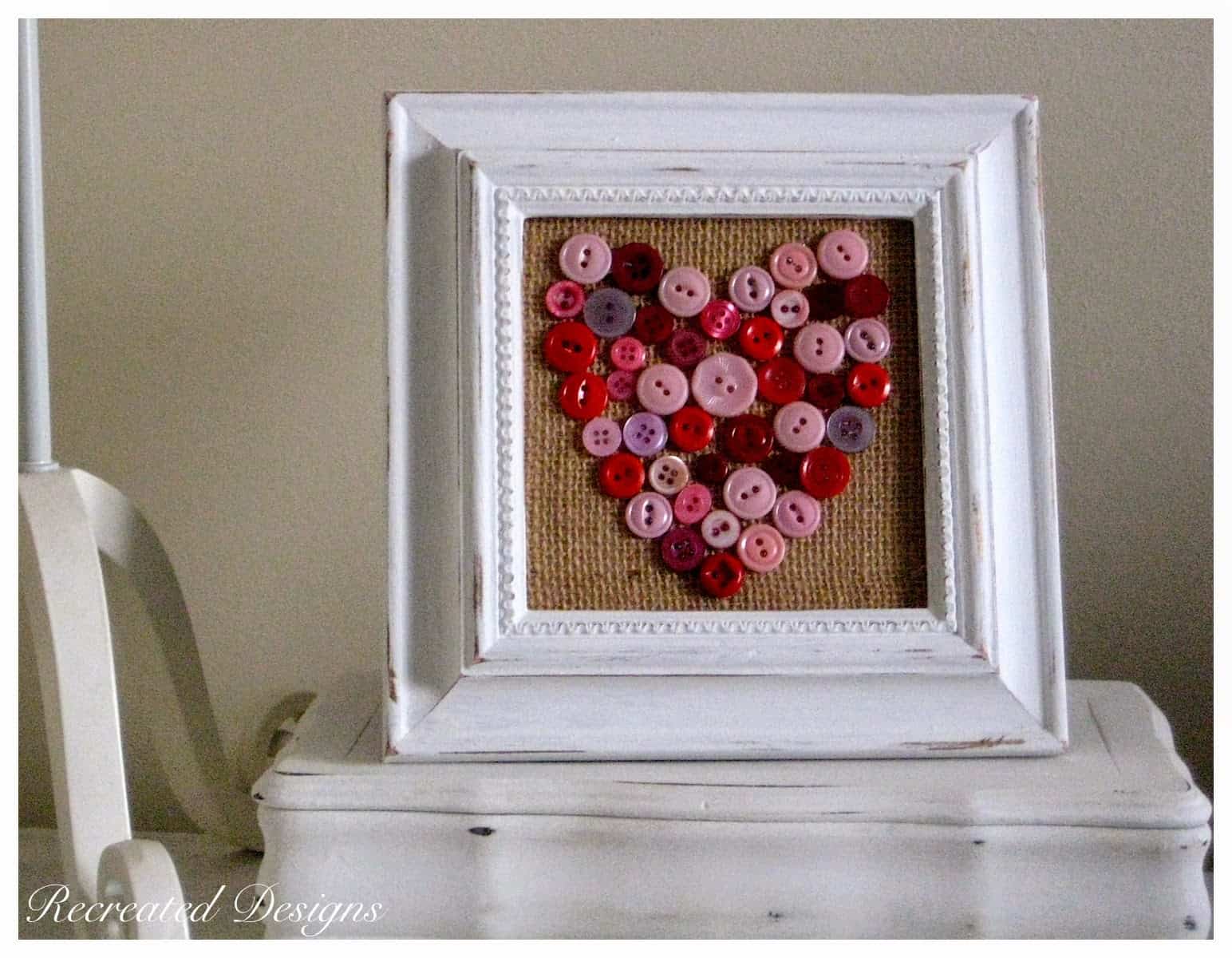 vintage buttons made into a heart on burlap in a reclaimed frame