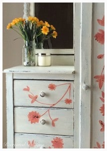 yellow flowers on a piece of painted furniture