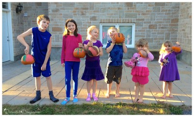 kids_showing_off_their_painted_pumpkins