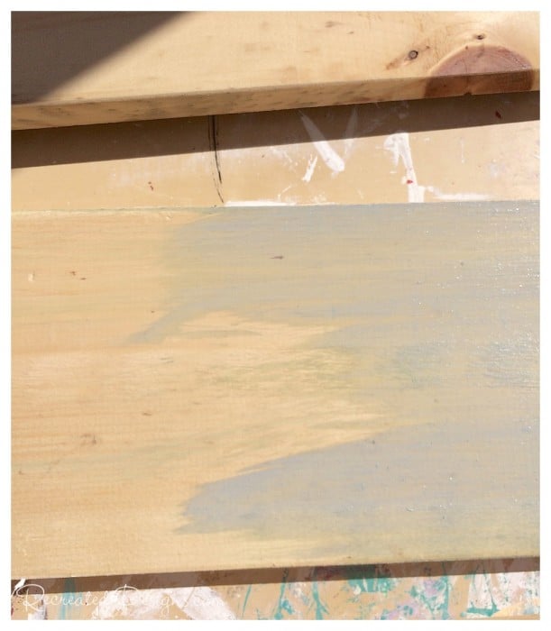 pine board being washed with Miss Mustard Seed Milk Paint in Shutter Grey