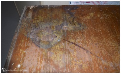 badly damaged veneer on an antique dresser