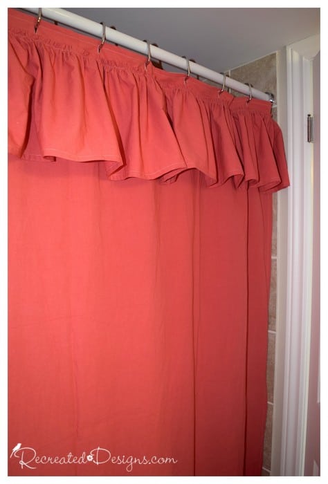 a coral coloured DIY shower curtain