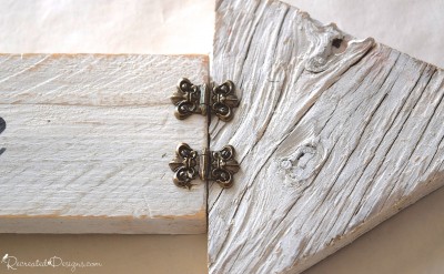 brass coloured vintage hardware on white painted wood