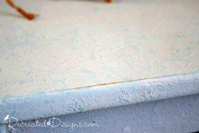 the texture of a coffee table painted with Milk Paint and Saltwash