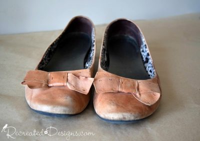 Peach coloured leather shoes in terrible shape