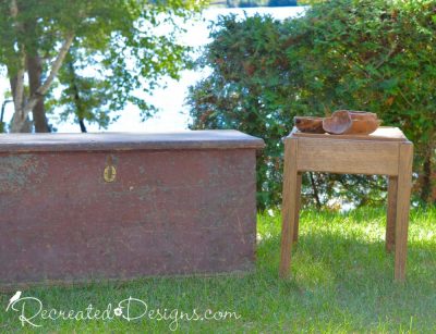 antique trunk and a small side table with wooden bowls