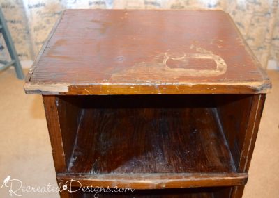 a severaly damaged old wood shelf