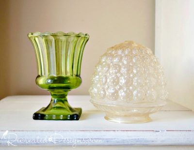 A glass vase and light globe found at the dump "store" before painting