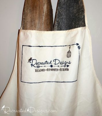 hand painted apron with Recreated Designs logo