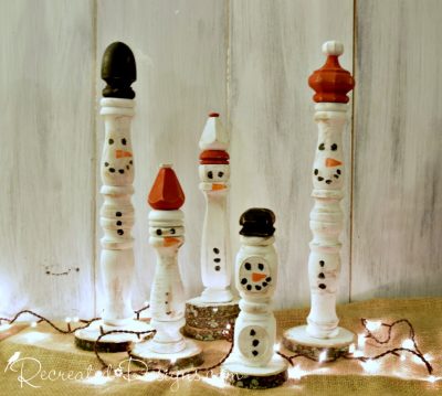 vintage spindles turned into snowmen with Christmas lights