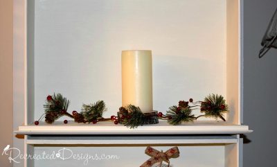 candle and Holiday greenery with berries