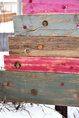adding vintage buttons to reclaimed painted wood