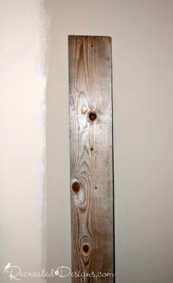 wood plank used to draw lines on the wall