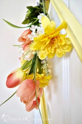 Spring flowers and a frame hanging on a door