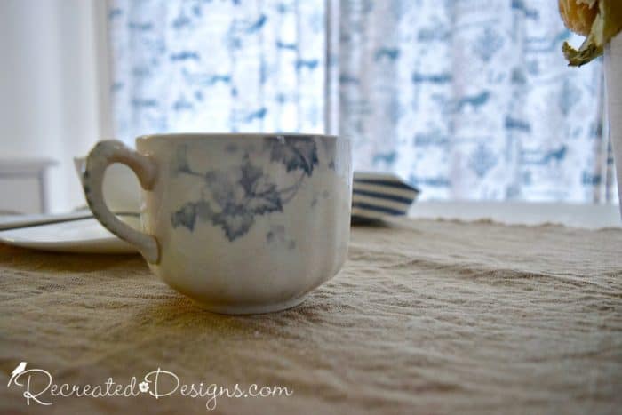 old tea cup with blue flowers