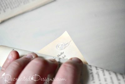 rolling old book pages and closing them with hot glue