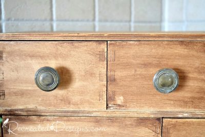 reclaimed knobs on stained pine drawers