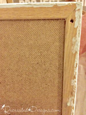 salvaged cork board with holes and paint