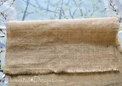 adhering burlap to glass to make the backdrop for a memory board