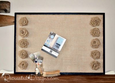 reclaimed cork board covered with burlap and burlap flowers