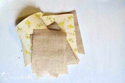 bunting pieces cut from vintage wallpaper and burlap