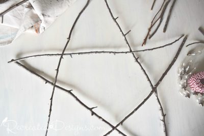 laying out twigs to make a star