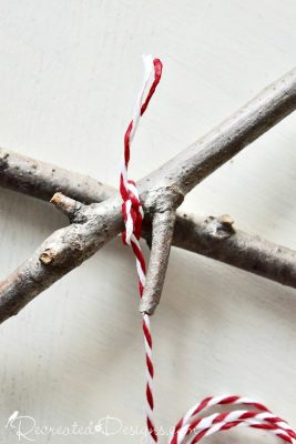 wrapping twigs with IKEA red and white twine