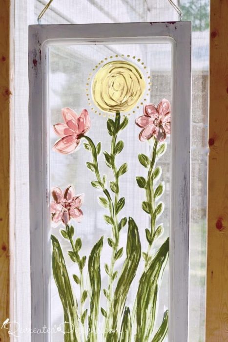 hand painted flowers on a reclaimed window