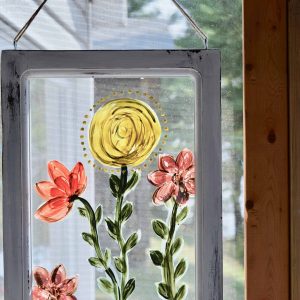 using Country Chic Paint to hand paint flowers on a window
