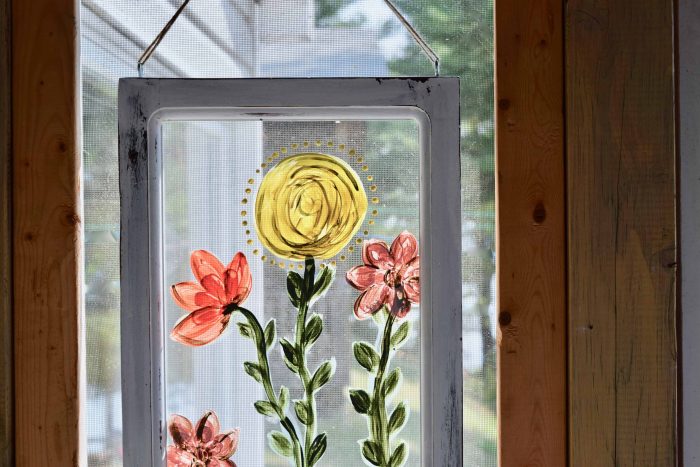 using Country Chic Paint to hand paint flowers on a window