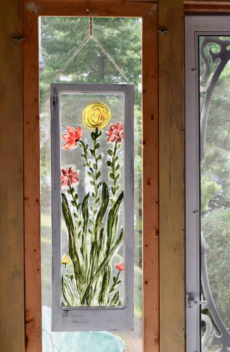 hand painted flowers on a window