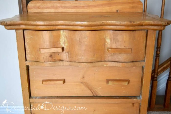 a beat up old dresser from the Habitat for Humanity store