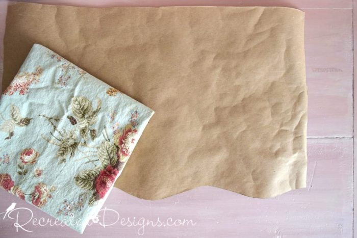 cutting out a pattern to make a drawer liner out of reclaimed fabric