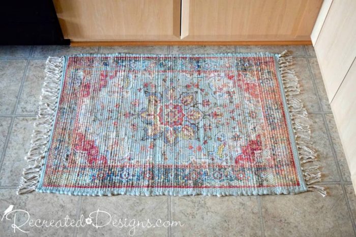 small rug with turquoise and burgundy pattern