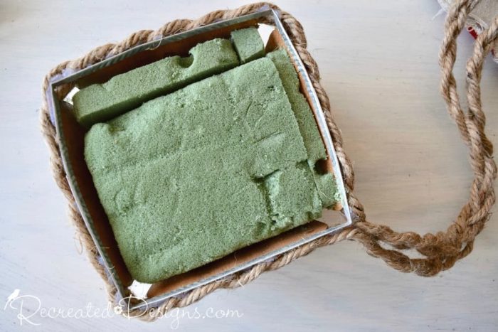 stuffing an old picking basket with floral foam