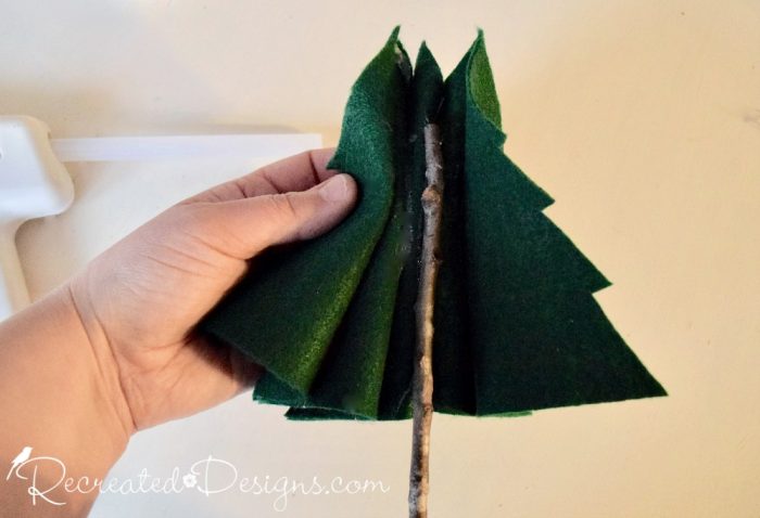 adding real twigs to felt Christmas trees