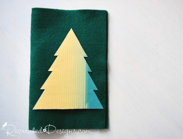 making Christmas trees out of felt using a pattern