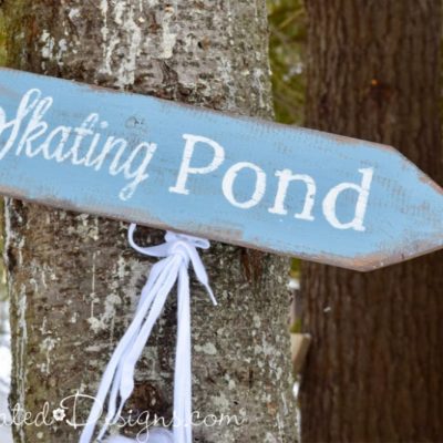 Skating Pond sign hanging on a tree