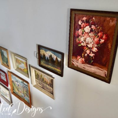collection or vintage art in a stairwell
