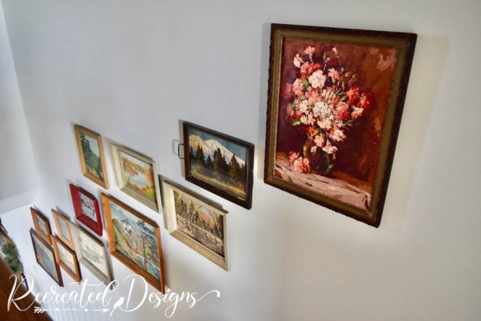 collection or vintage art in a stairwell