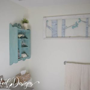 bathroom done in creams and teal