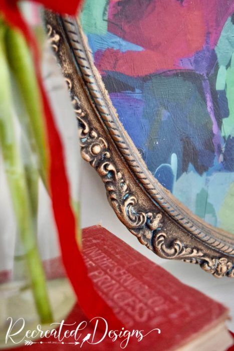 details on a vintage mirror painted gold