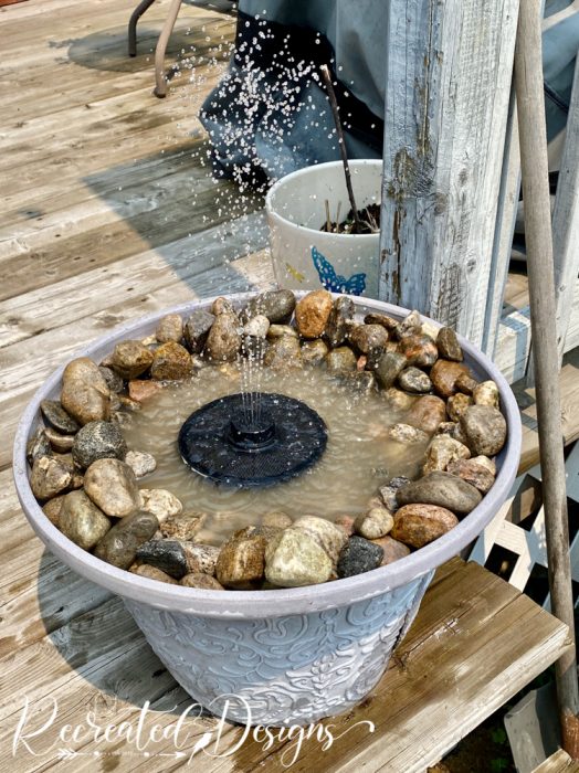solar fountain in a flower pot
