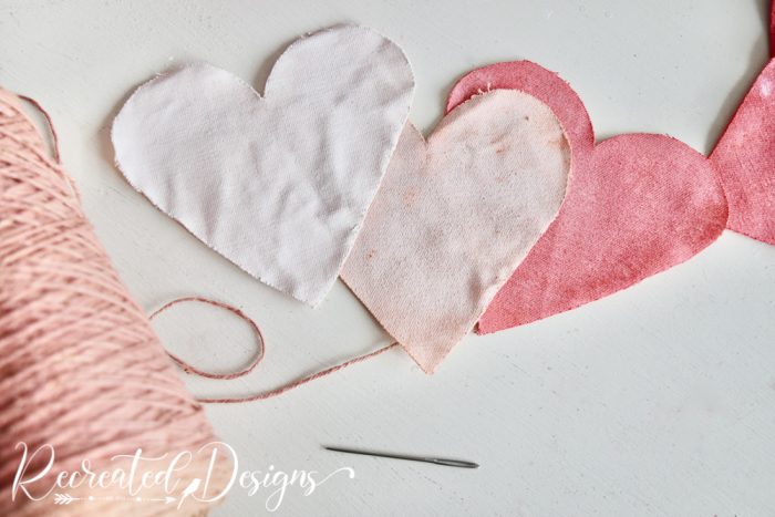 getting ready to string hearts together