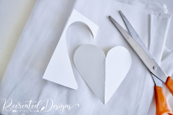 cutting out a cardboard heart
