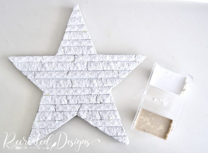 wood star covered with paper clay mouldings