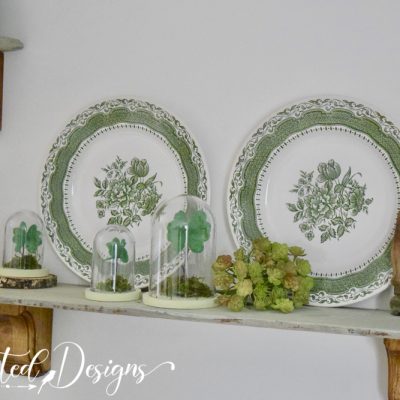 green plates and vintage finds on a shelf