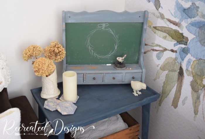 vintage chalboard sitting on an old table