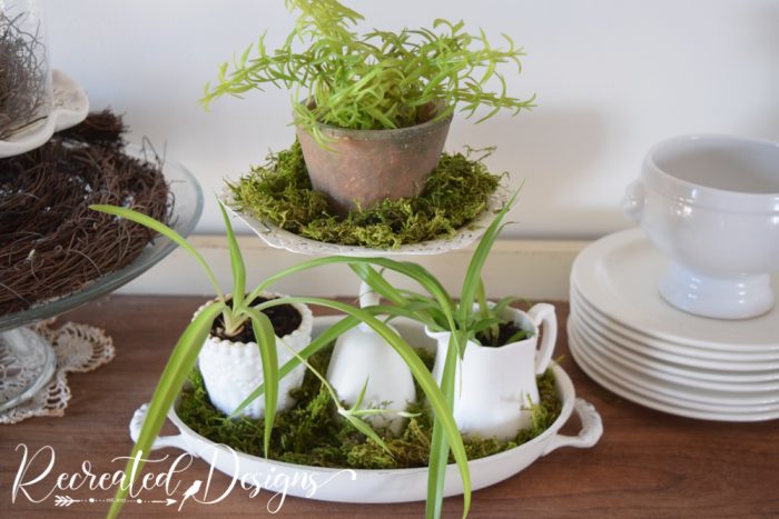 vintage tiered stand with small plants